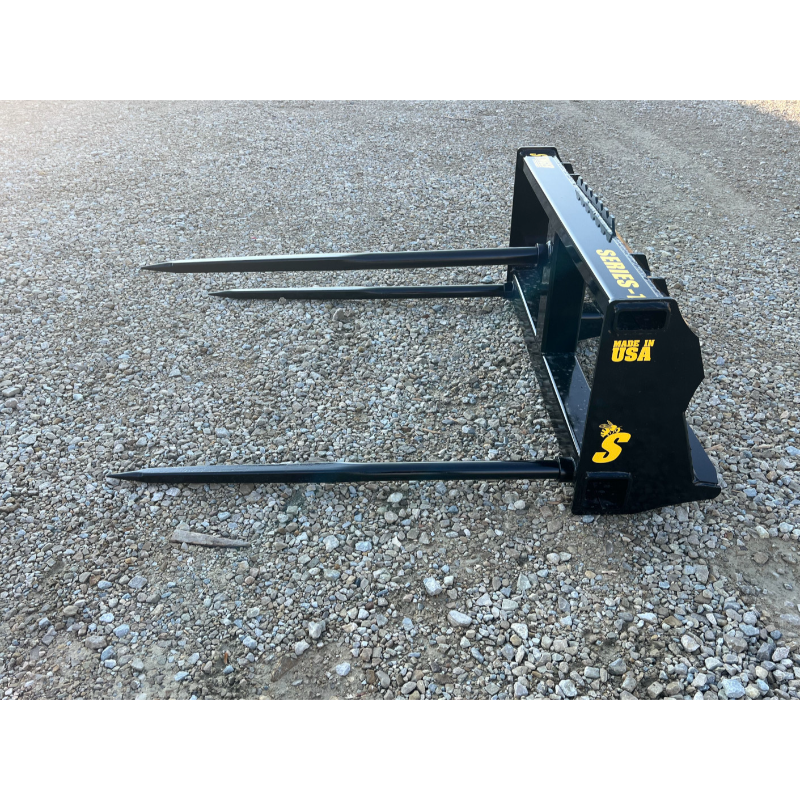 Stinger Attachments BS1 Series skid steer bale spear with three long spears on gravel surface, gallery 11 square shot