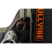 Close-up of black mechanical vibration control knob with orange markings on steel equipment housing near orange BullVibe label