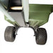 Underside view of green Swisher 16 cu ft poly tow-behind cart with rugged tread tires, gallery position 1
