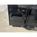 Black steel attachment with serrated clamp teeth and hinge on smooth concrete floor indoors