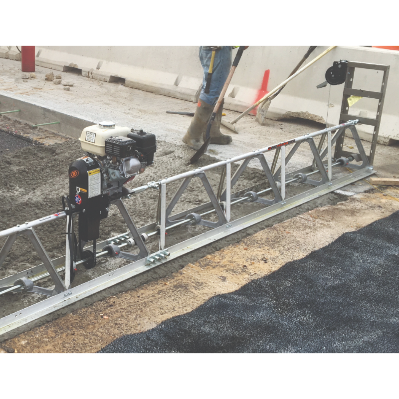 MBW Modular Vibratory Truss Screed with Honda GX160 engine leveling concrete on construction site, gallery position 1