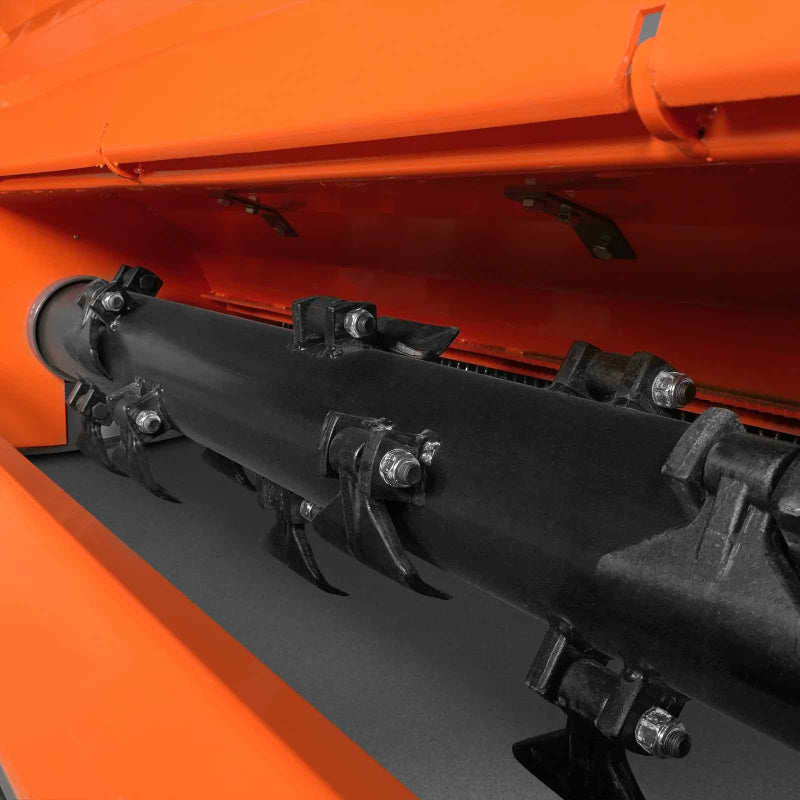 close-up underside view of black rotor shaft and flail blades inside orange MechMaxx 63-inch PTO mower gallery position 1