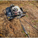 Swisher 44-inch rough cut brush cutter with 15.5HP engine and tow hitch, clearing brush, gallery position 1 view