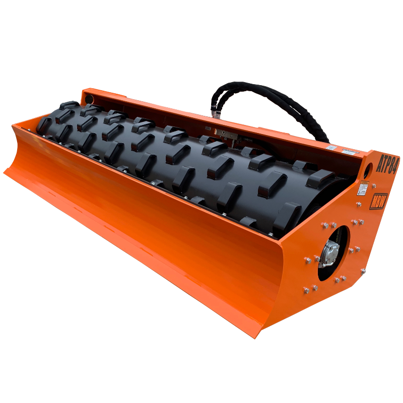 Orange soil compaction roller attachment with black spiked drum and curved front blade viewed from front-left angle