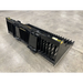 Black steel skid steer rock bucket attachment with spaced tines and reinforced side panels on concrete floor