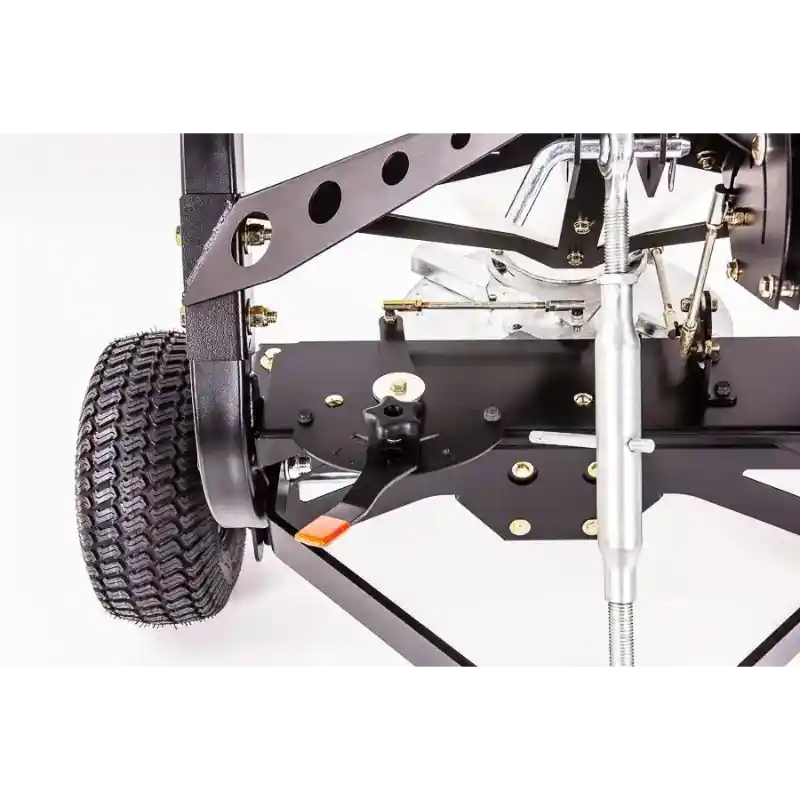 Close-up of metal frame, adjustment lever, pneumatic tire, and mounting hardware on Swisher 52-Gallon Tow-Behind Spreader gallery 1
