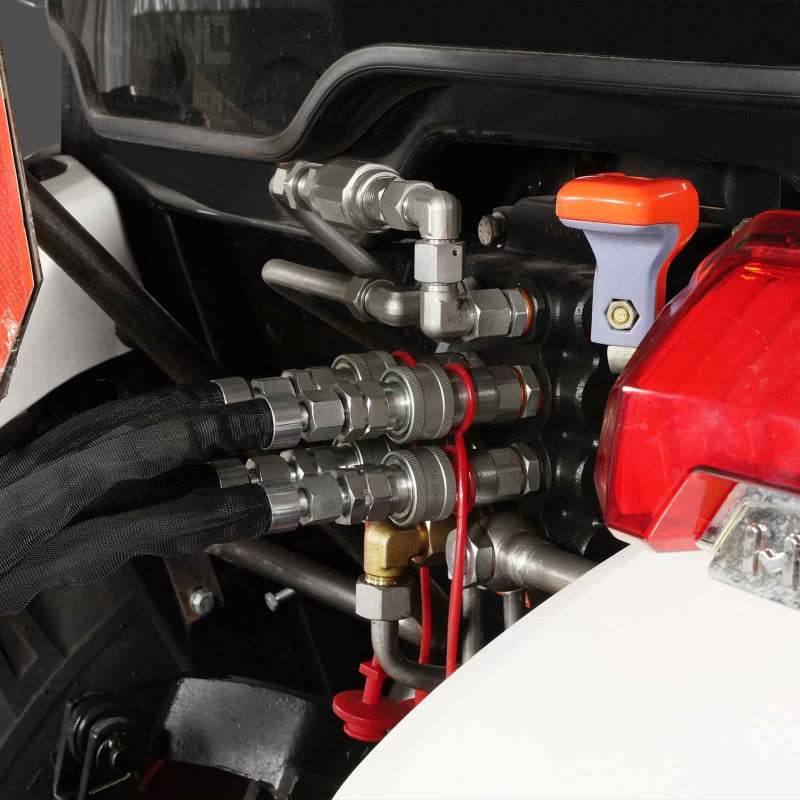 close-up of hydraulic quick-connect couplers and metal fittings on tractor attachment at gallery position 1