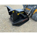 Black steel disc mulcher attachment with hydraulic lines mounted to skid steer on gravel surface