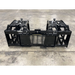 Black steel skid steer grapple attachment with hydraulic cylinders, dual arms, and reinforced crossbars on concrete floor surface
