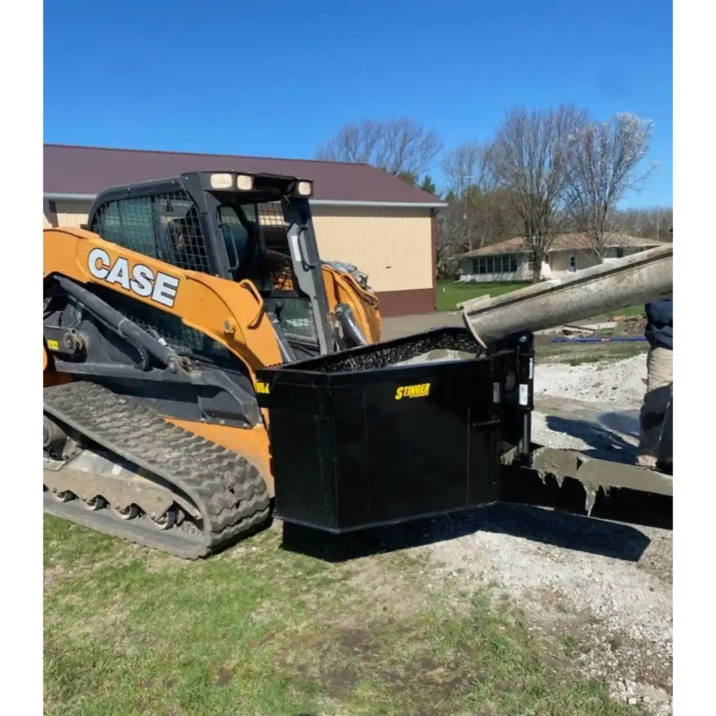 Yellow CASE skid steer with attached black Stalker concrete screed pouring concrete on construction site