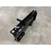 Black painted steel receiver hitch plate with welded frame, mounting brackets, and bolt holes on concrete floor