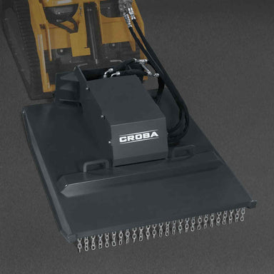 angled front perspective of 42-inch Groba mini skid steer brush cutter with hydraulic hoses and chain guard gallery position 1