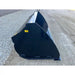 Right side view of black steel skid steer construction bucket with smooth edges and "Made in USA" decal on gravel and dirt ground