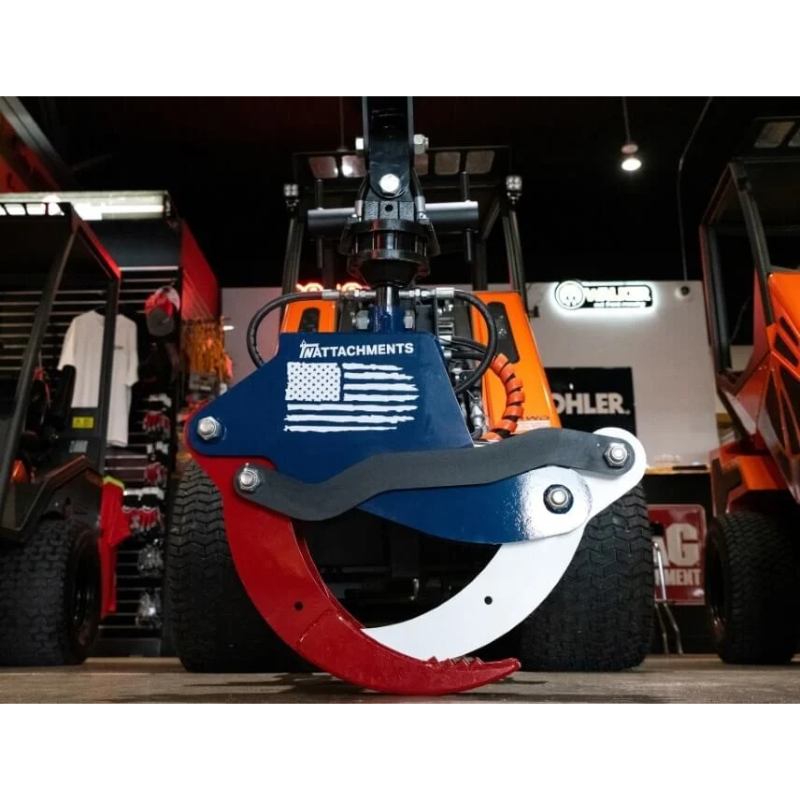 Rotating grapple attachment with red, black, and white curved steel claws and American flag decal on blue mounting plate