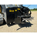 Black skid steer stump grinder attachment with multiple steel cutting teeth and hydraulic hoses on gravel surface