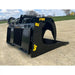 Black metal skid steer rock grapple attachment with wide curved tines, hydraulic lines, and yellow Stinger branding on dirt surface outdoors