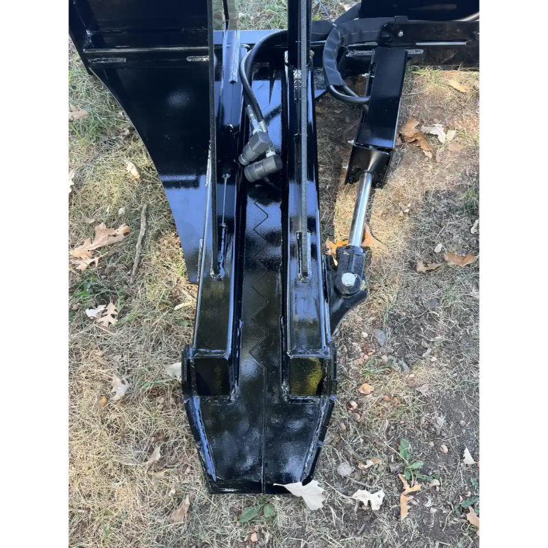 Close-up of Stinger Attachments STP tractor tree puller, showing hydraulic components and metal claw, gallery image 16